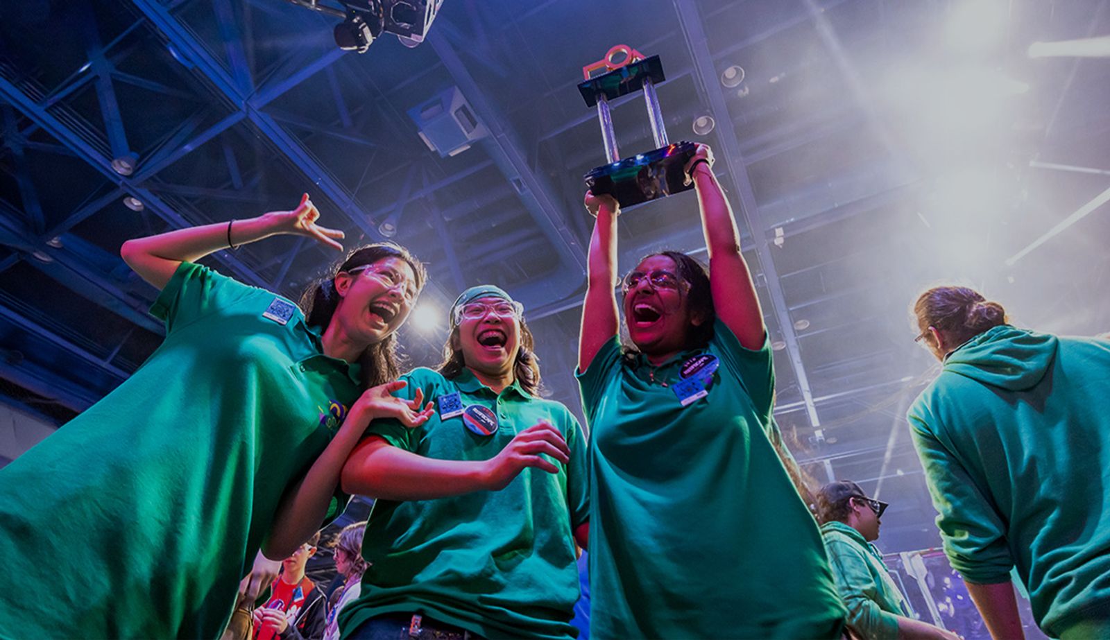 Image with an overlay showing the FRC 2910 team celebrating a win in 2025.