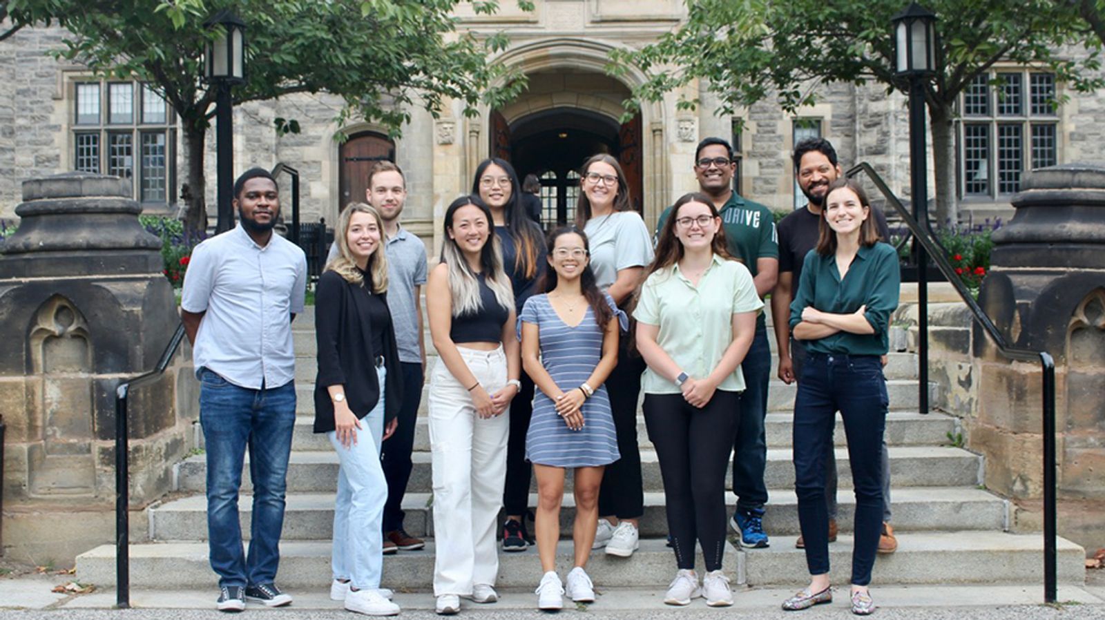 Dr. Alison Olechowski stands with her Tufts research group.