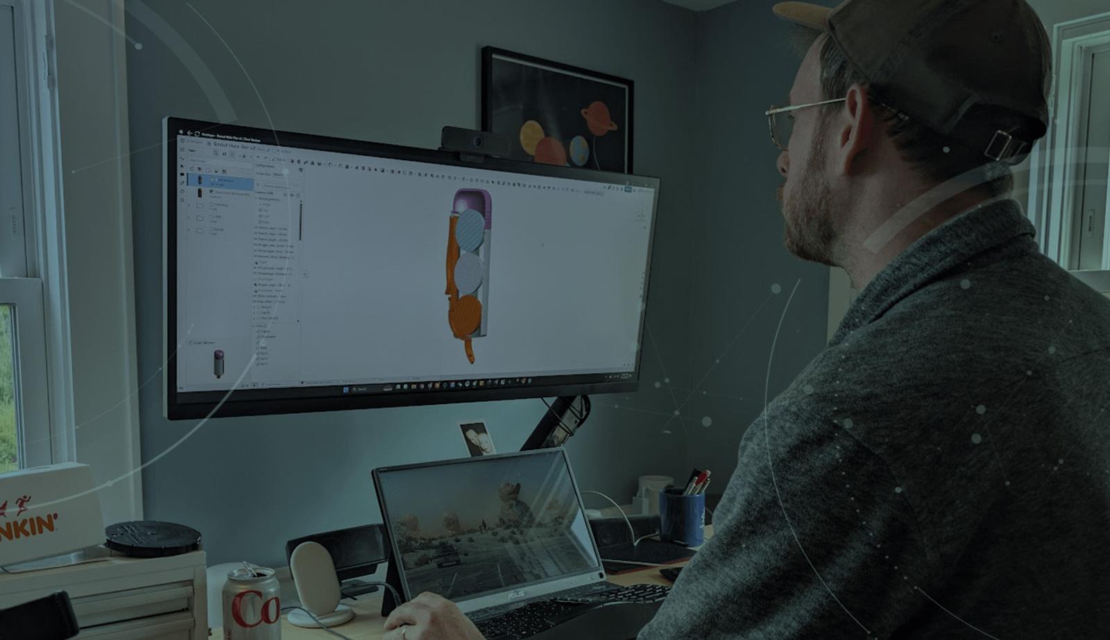 Image darkened with an overlay of informal's Sam Holland using Onshape to design a donut hole-der.