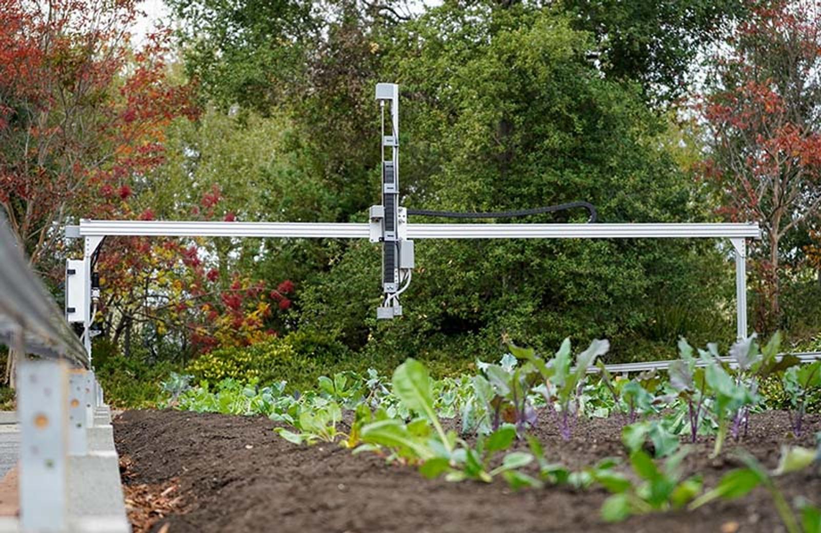 One of FarmBots robots watering crops