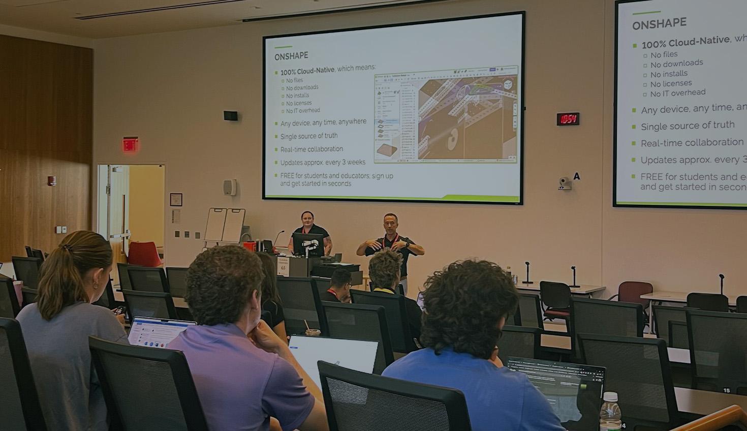 Image with an overlay showing an Onshape presentation at an event.