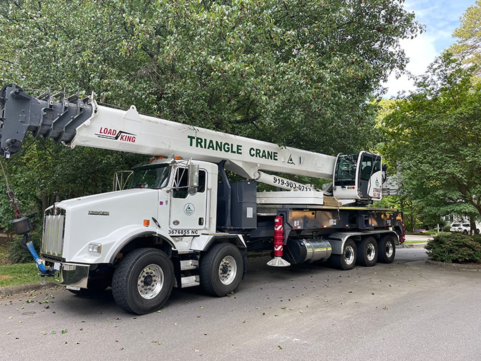 crane truck parked on street