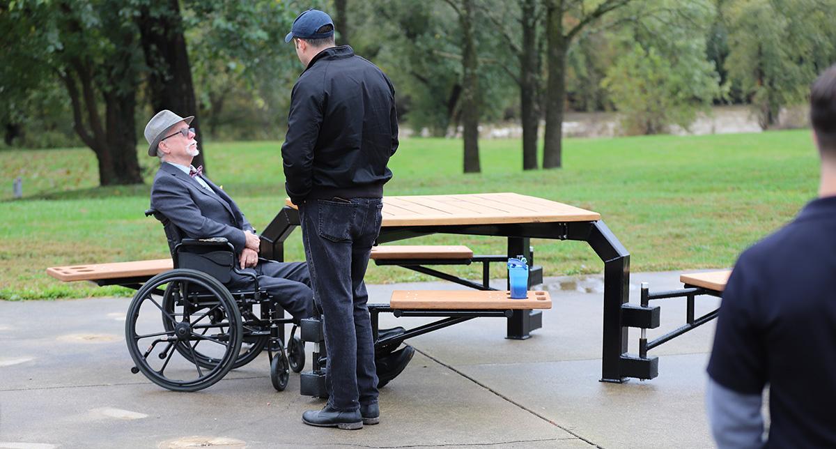 Image showing a wheelchair user at a picnic table.