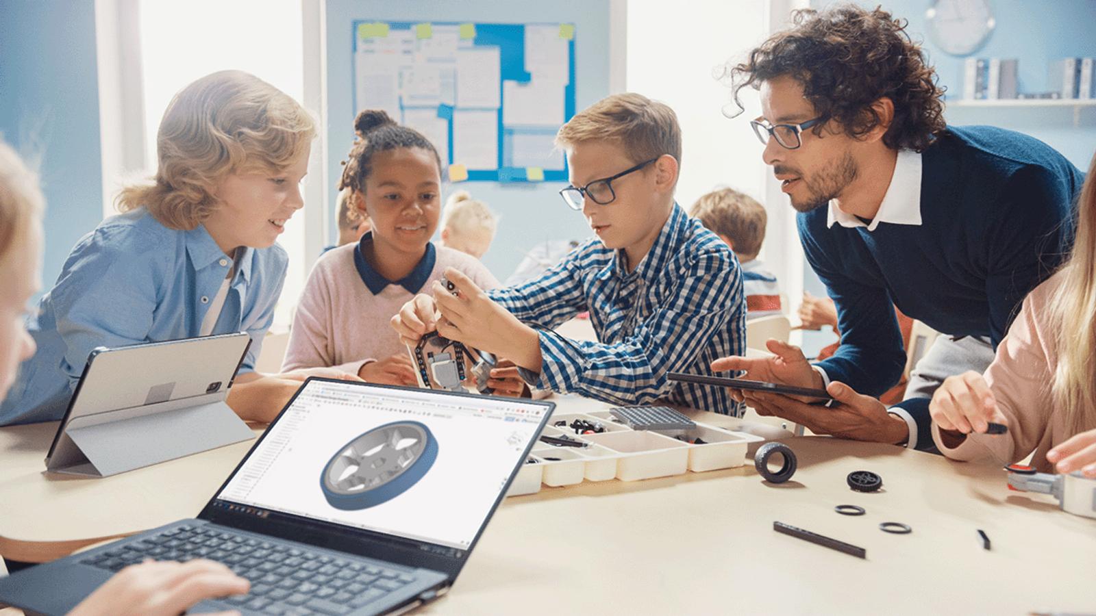 STOCK PHOTO OF KIDS USING ONSHAPE ON CHROMEBOOKS/TABLETS.