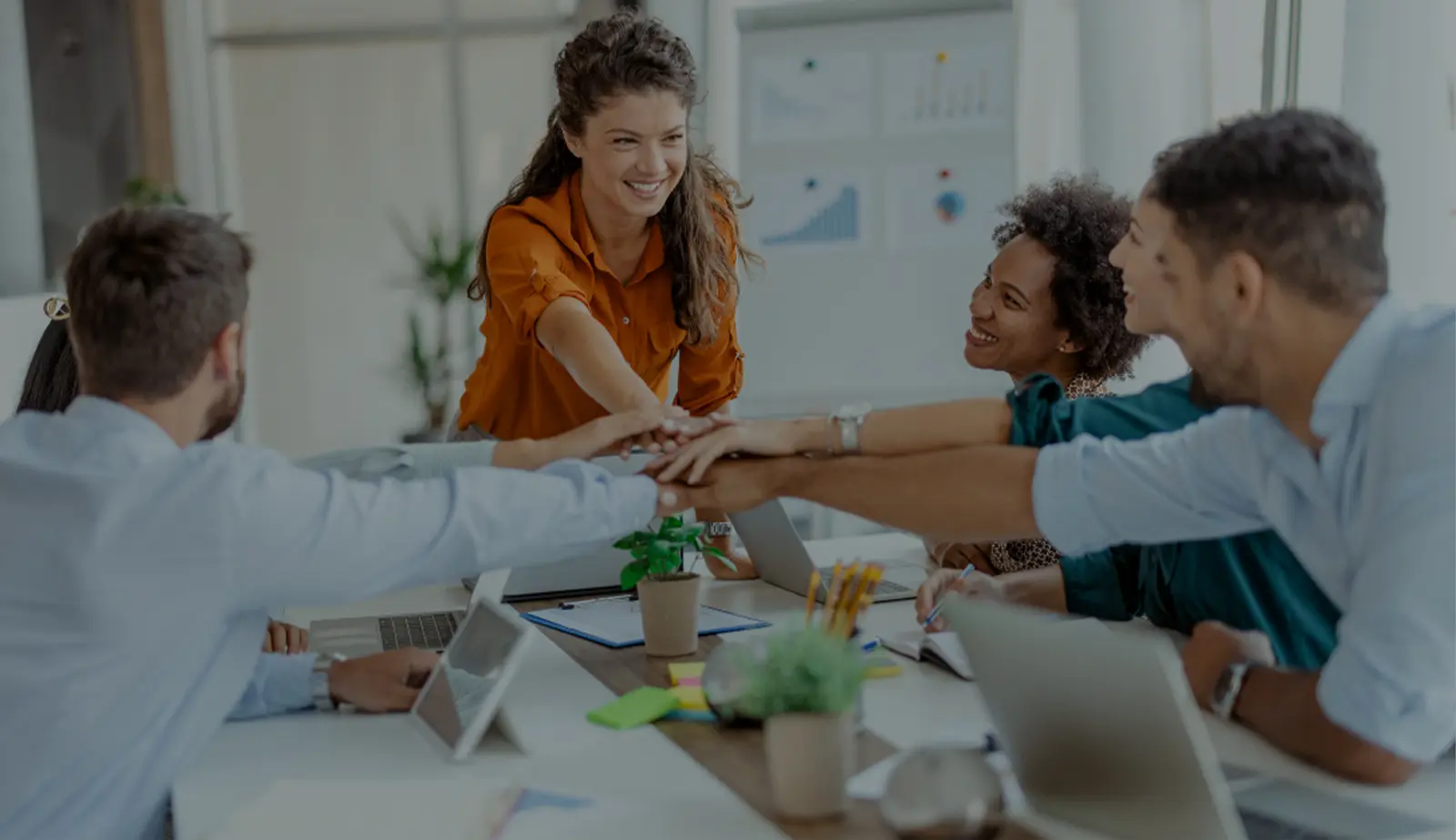 Stock image with an overlay showing a team leader and her team.