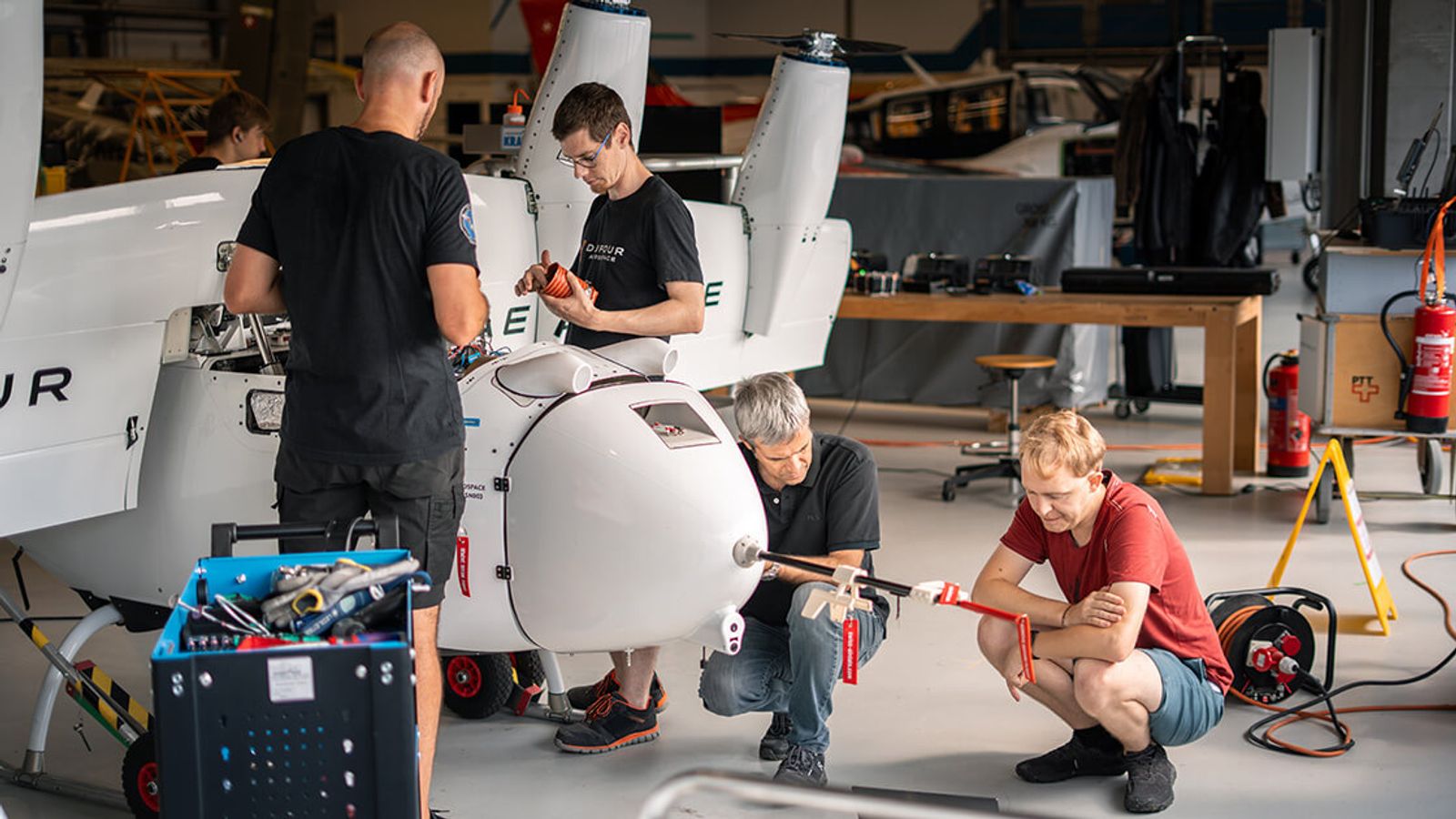 Dufour Aerospace team members assembling one of their drones.