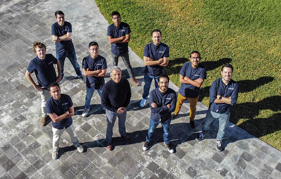 The Imago Aerospace team stands on a lawn in 2023