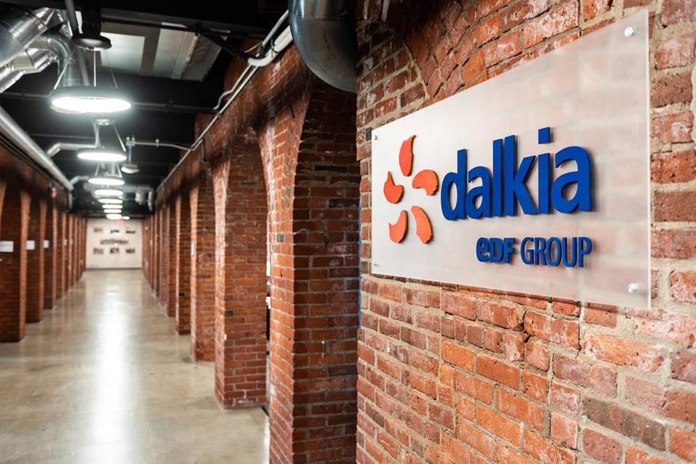 Dalkia logo on sign on brick wall