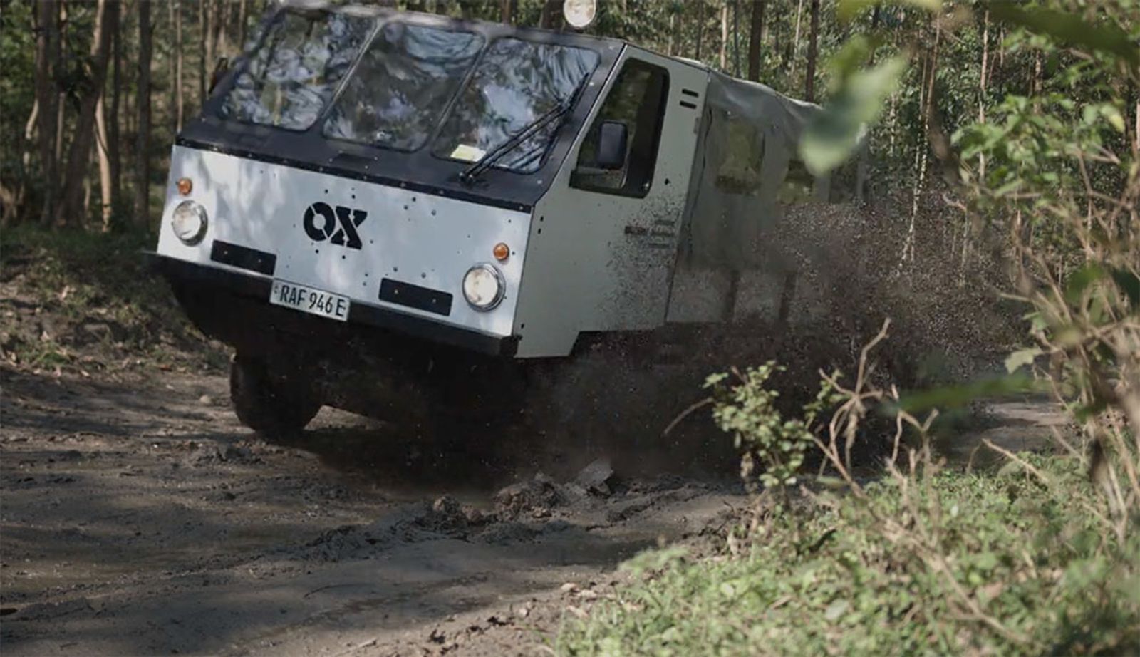 Ox Delivers truck driving through muddy road