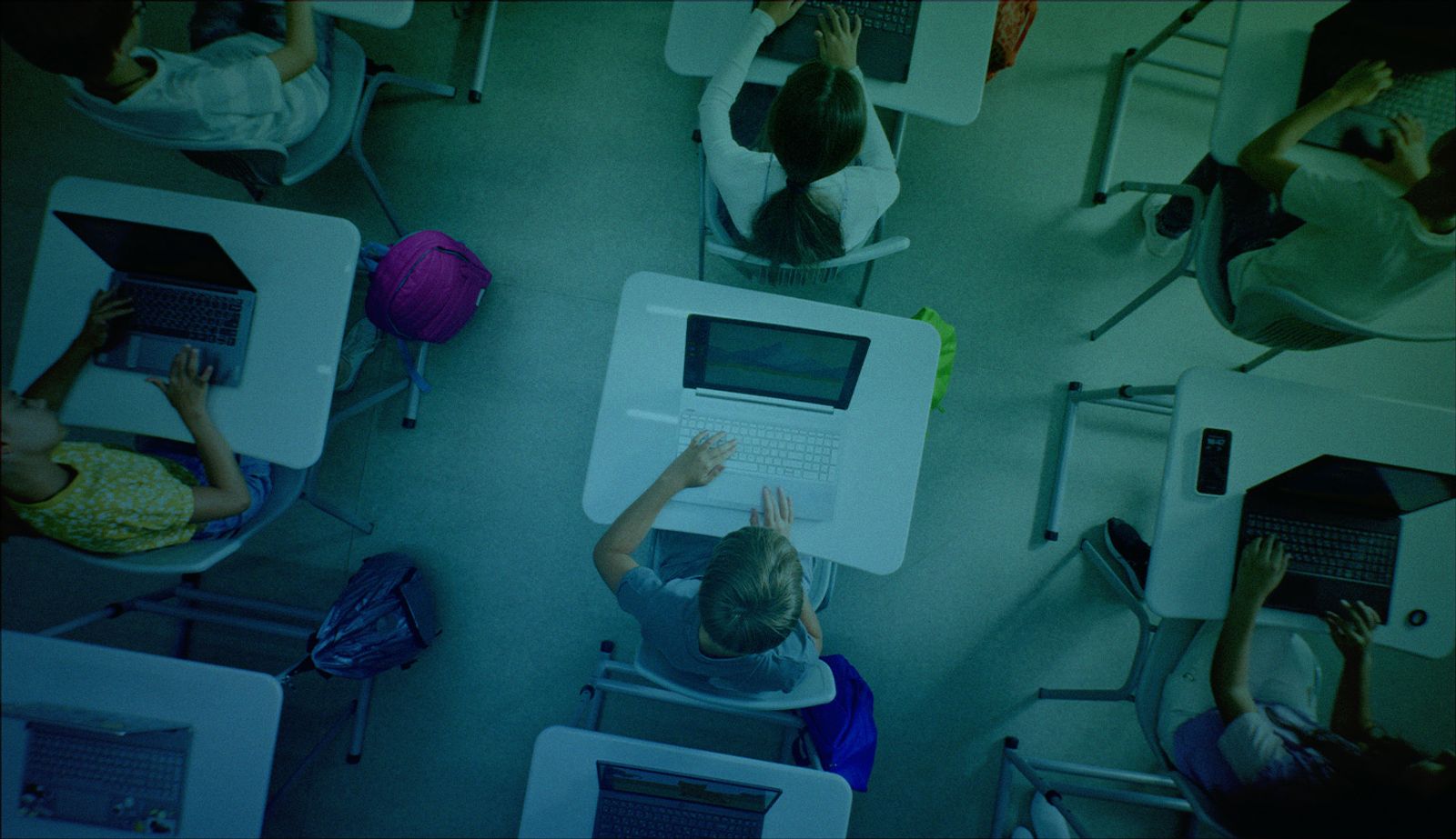 Stock image with a stylized overlay showing an overhead look at a classroom.