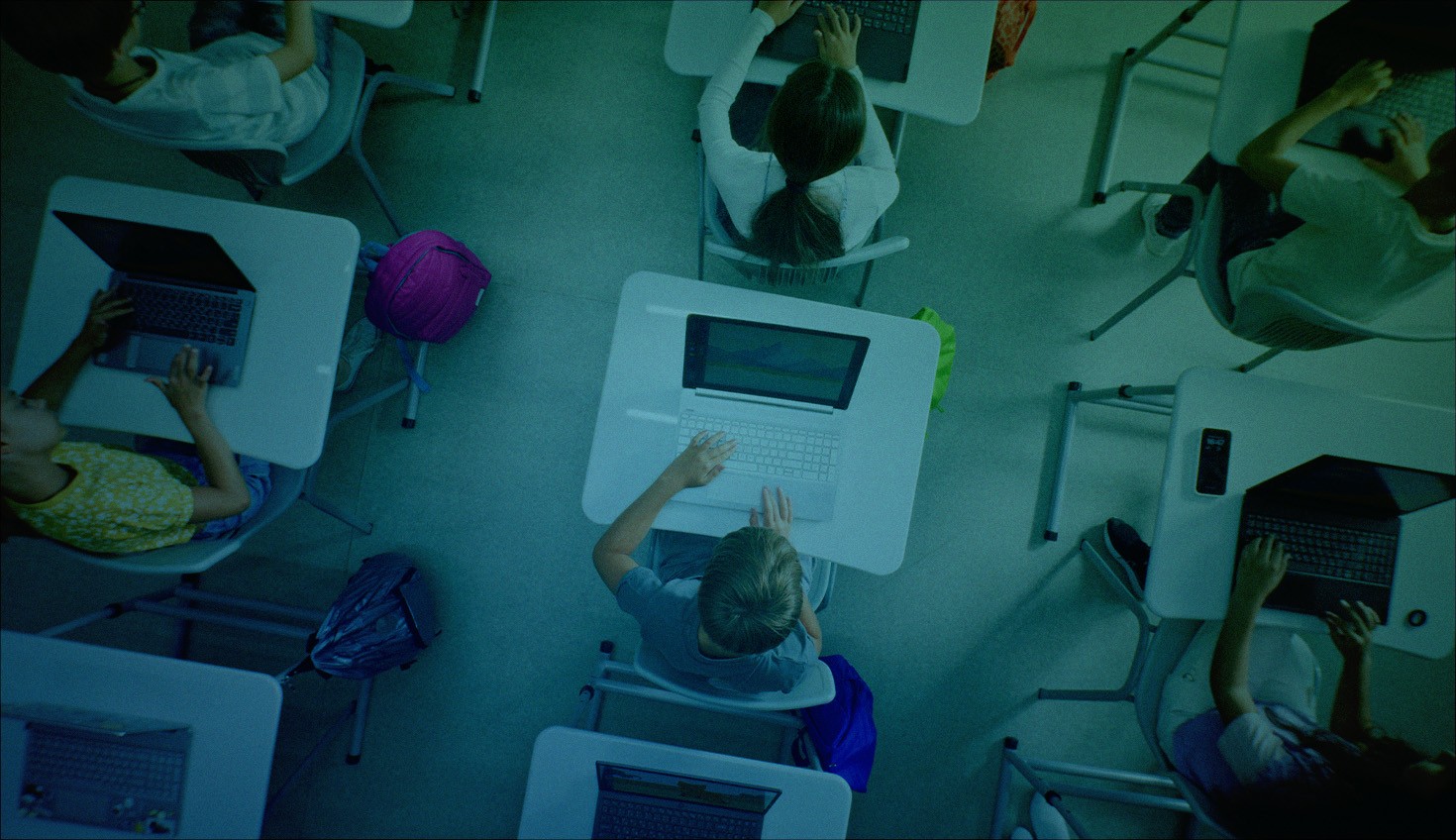 Stock image with a stylized overlay showing an overhead look at a classroom.