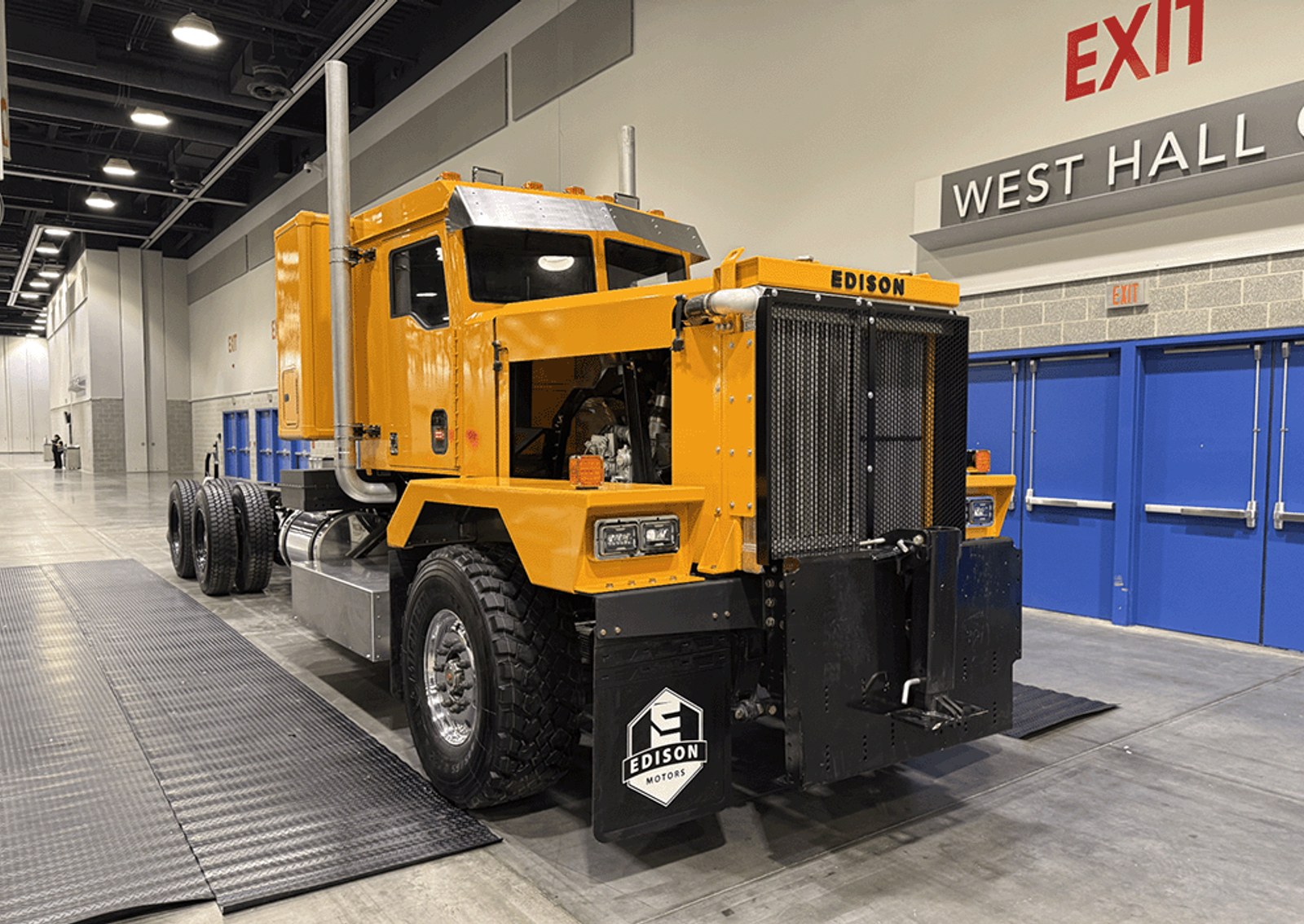Image showing a hybrid truck designed by Edison Motors in a showroom.