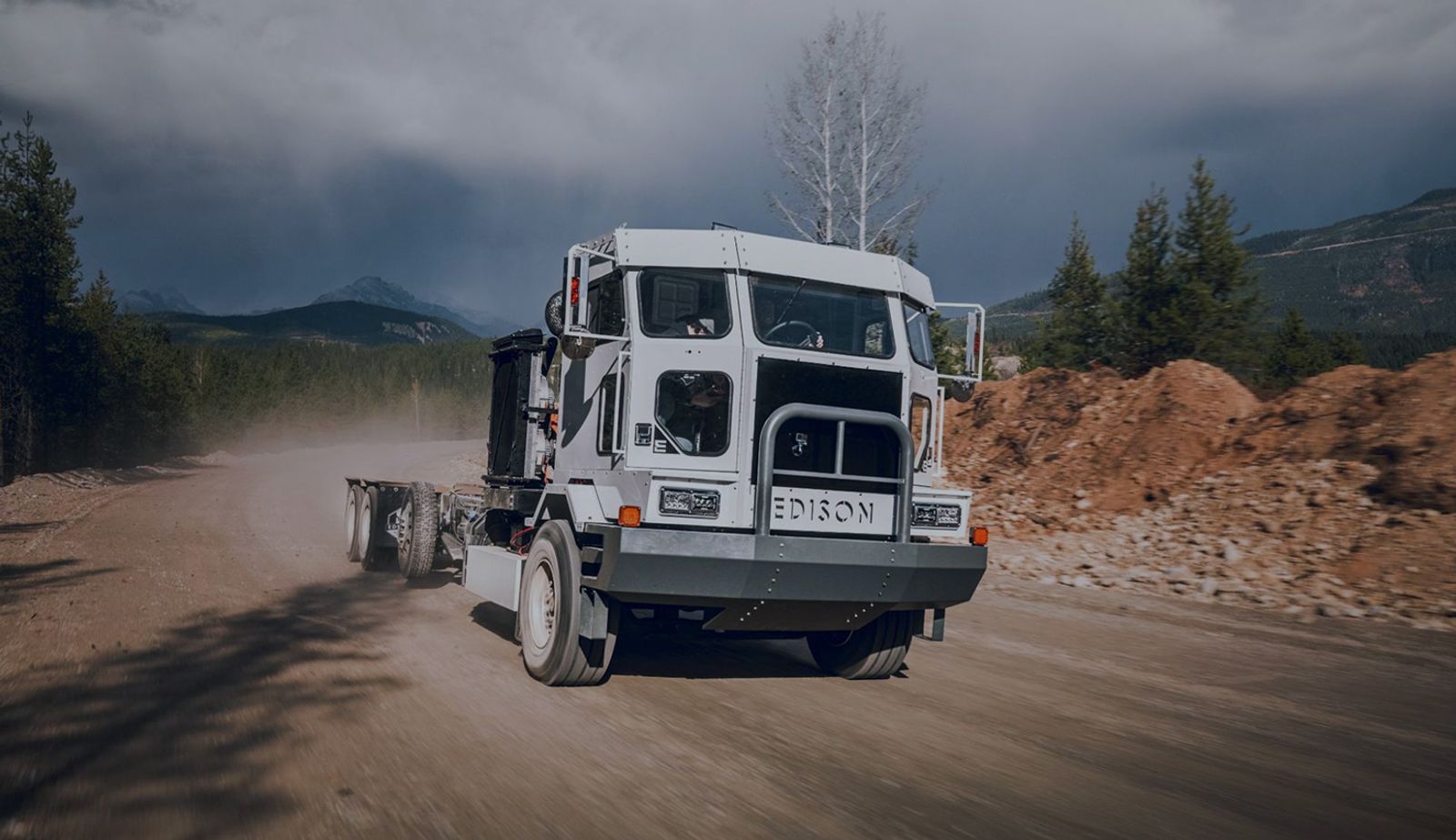 Image with an overlay showing a hybrid trucks designed by Edison Motors.