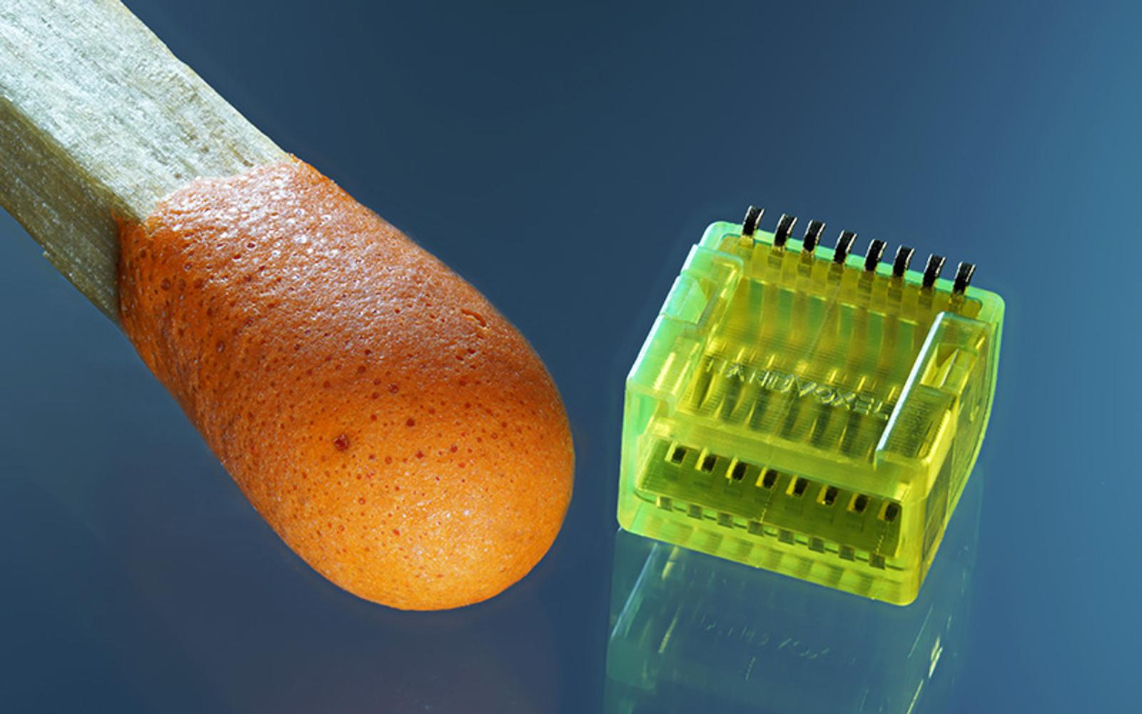 NanoVoxel’s microprinted connector, designed in Onshape, compared to the tip of a matchstick.