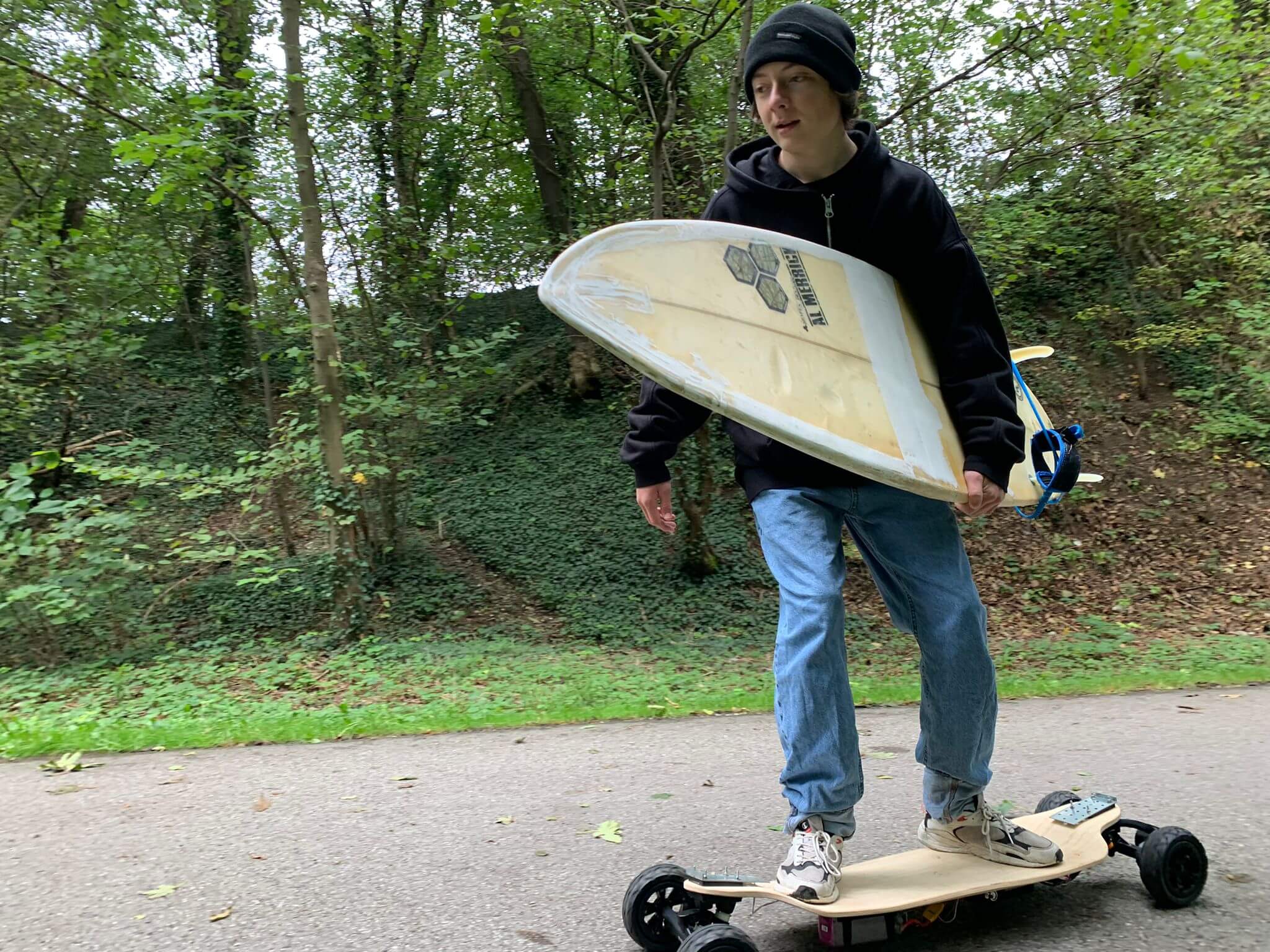 A student riding a longboard