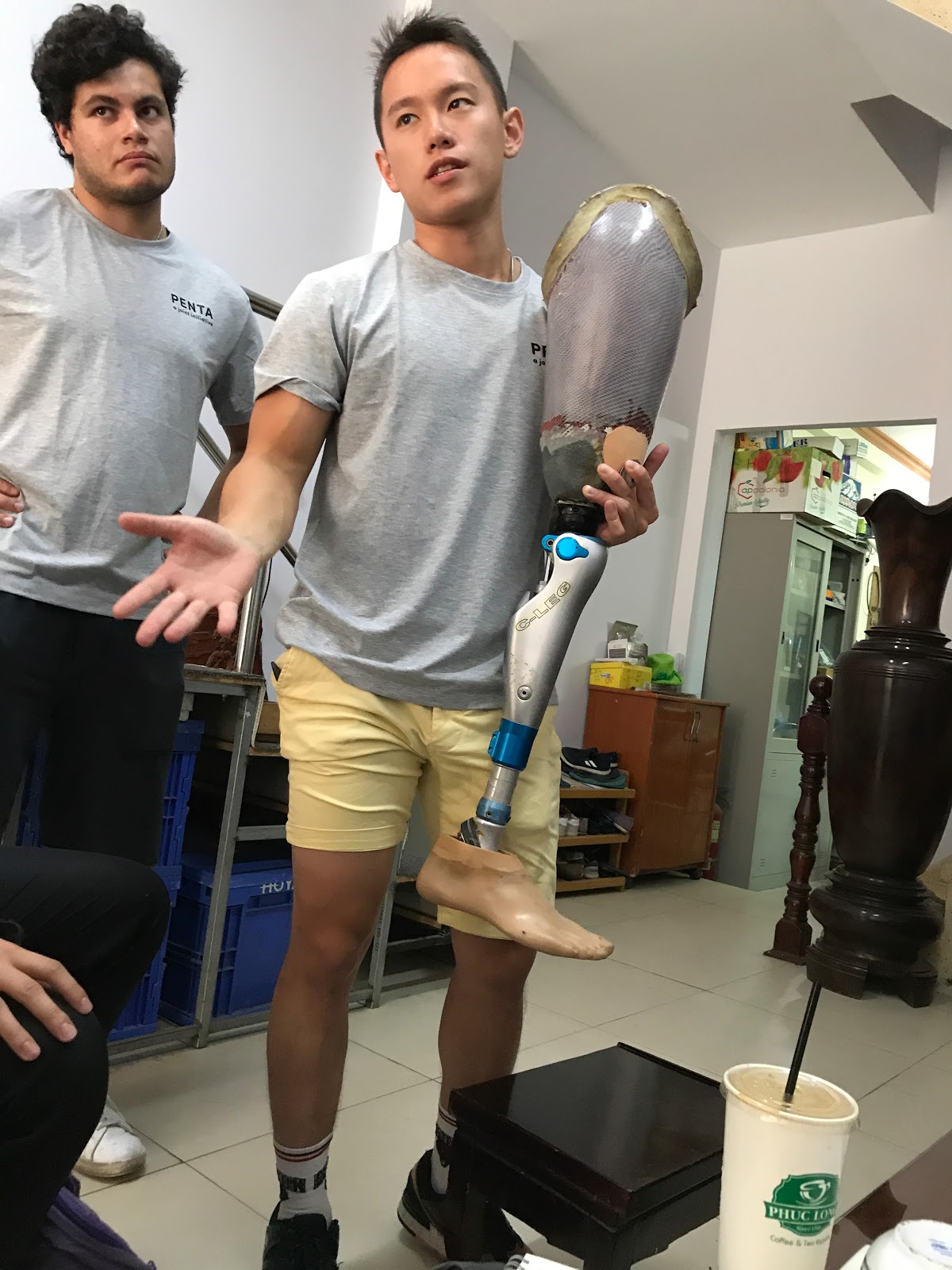 Photo of Koi Prosthetic co-founders Luke Morales (left) and Matthew Lo visiting a prosthetic clinic in Vietnam.